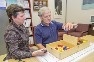 Caretaker playing game with patient